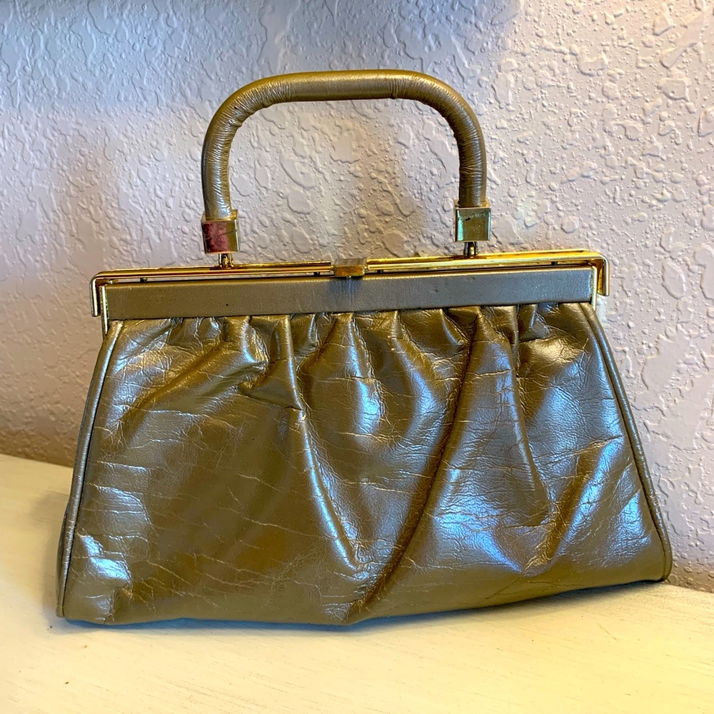 Vintage clutch purse with metal hardware